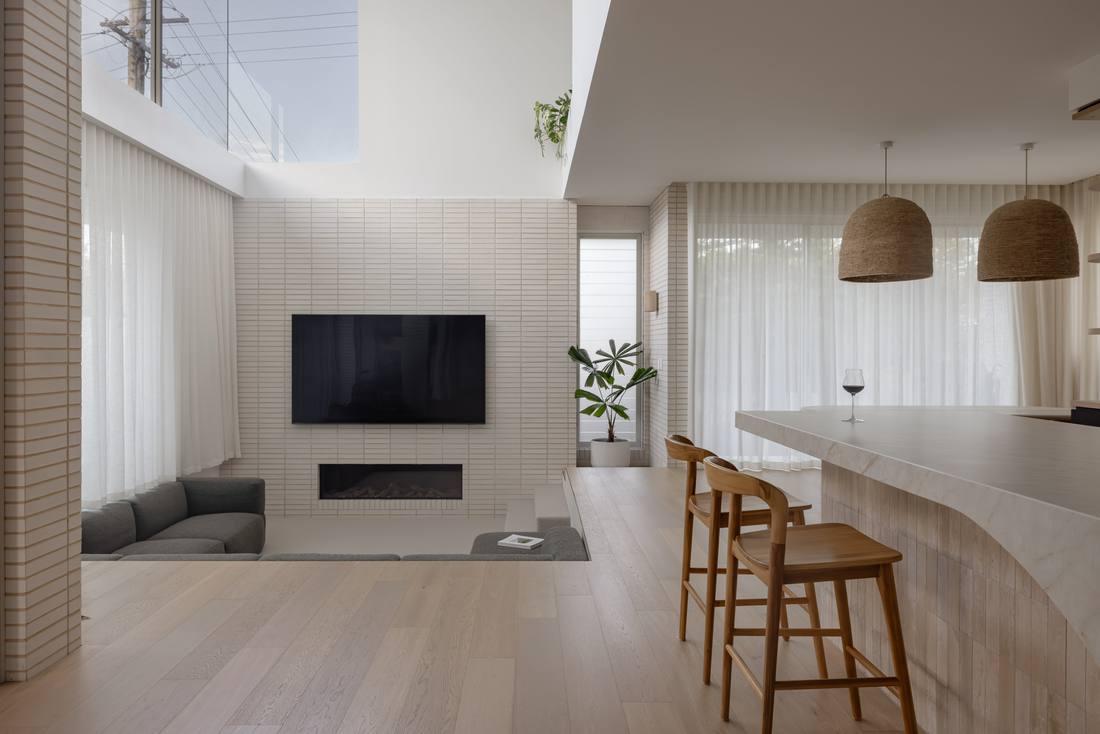 Light-filled open-plan living room with engineered oak timber flooring
